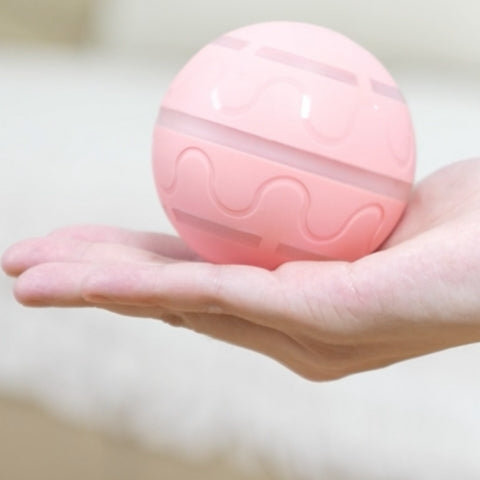 balle-pour-chien-rose-main